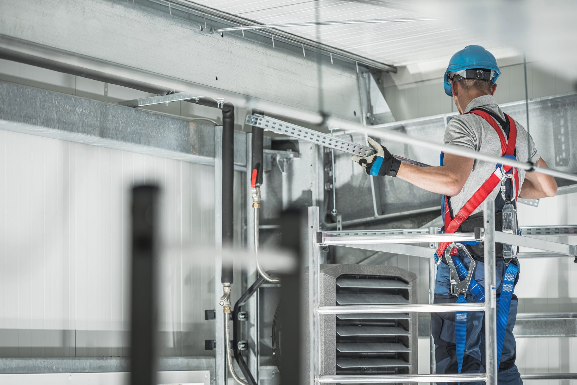 An engineer inspecting installed services on site.